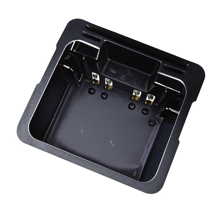 Top down interior view showing electrical contact charging pins inside the Icom AD132N battery adapter cup.