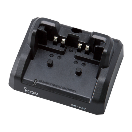 Icom BC227 Rapid Desktop Charger for Icom IC-M85 showing the empty battery drop-in slot and LED light indicator.