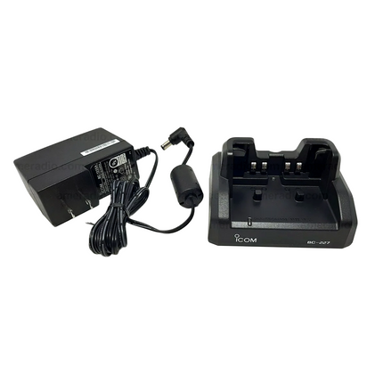 Complete Icom BC227 rapid charging kit unboxed alongside the included BC-123SA AC wall power adapter.