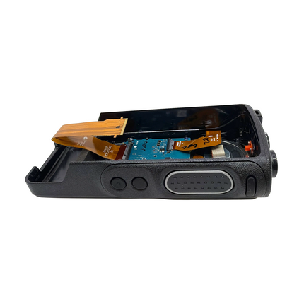 Side profile of the Motorola PMLN7323B replacement housing showing Push-To-Talk and accessory bezels.